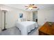 Bright bedroom with white walls, plush carpet, ceiling fan and a comfortable bed at 2131 Ridge S Rd # 19, Largo, FL 33778