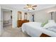 Comfortable bedroom with a cozy bed, wooden dresser, and a view into the living area, perfect for relaxation at 2131 Ridge S Rd # 19, Largo, FL 33778
