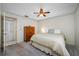 Comfortable bedroom with natural light, ceiling fan, and a connecting bathroom at 2131 Ridge S Rd # 19, Largo, FL 33778