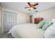 Bright bedroom featuring a ceiling fan and closet, ideal for relaxation at 2131 Ridge S Rd # 19, Largo, FL 33778