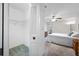 View of spacious bedroom with closet, neutral carpet and access to a dressing area at 2131 Ridge S Rd # 19, Largo, FL 33778