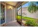 Screened-in patio looking out towards the yard and complex's landscaping at 2131 Ridge S Rd # 19, Largo, FL 33778