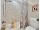 Clean bathroom with a shower-tub combination, shower curtain and modern fixtures at 2174 Kent Ave, Clearwater, FL 33764
