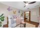 Charming bedroom with playful decor, a cozy daybed, and closet access at 2174 Kent Ave, Clearwater, FL 33764