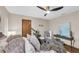 Serene bedroom featuring a plush bed, stylish decor, and a relaxing ambiance with ceiling fan at 2174 Kent Ave, Clearwater, FL 33764