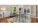 Dining area with backyard pool view and modern chandelier at 2174 Kent Ave, Clearwater, FL 33764