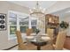 Breakfast nook with view of a stone fireplace and a pool at 2174 Kent Ave, Clearwater, FL 33764