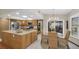 Modern kitchen with stainless steel appliances, granite countertops, and dining area at 2174 Kent Ave, Clearwater, FL 33764