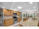 Inviting kitchen featuring stainless steel appliances, granite countertops, and ample cabinet space at 2174 Kent Ave, Clearwater, FL 33764