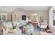 Sun-filled living room featuring modern decor, ample seating, and hardwood floors at 2174 Kent Ave, Clearwater, FL 33764