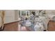 Bright living room with hardwood floors, neutral colors, and large bay window at 2174 Kent Ave, Clearwater, FL 33764