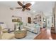 Relaxing living room space mirroring the kitchen with hardwood floors and natural lighting at 2174 Kent Ave, Clearwater, FL 33764