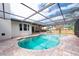 Private backyard pool with screened enclosure and brick paver patio at 2174 Kent Ave, Clearwater, FL 33764