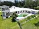 Aerial view highlighting the backyard's inviting pool and stylish patio, perfect for relaxation and entertainment at 21921 Us Highway 98, Dade City, FL 33523