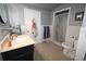 The modern bathroom features a tiled shower, sleek vanity, and stylish fixtures at 21921 Us Highway 98, Dade City, FL 33523