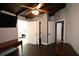 The bedroom features hardwood floors, doors to other rooms, and ceiling fan at 21921 Us Highway 98, Dade City, FL 33523