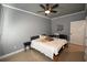 This bedroom offers a ceiling fan, stylish furniture and a cozy atmosphere at 21921 Us Highway 98, Dade City, FL 33523