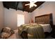 Bedroom featuring a comfortable bed, window and a wood-beamed ceiling at 21921 Us Highway 98, Dade City, FL 33523