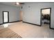 Spacious bedroom boasts tile flooring, access to a walk-in closet, and neutral paint at 21921 Us Highway 98, Dade City, FL 33523