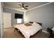 Bedroom with a ceiling fan, television, and neutral tones offers a relaxing retreat at 21921 Us Highway 98, Dade City, FL 33523
