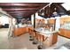 Open-concept kitchen featuring wood cabinets, granite countertops, stainless appliances, and a central island at 21921 Us Highway 98, Dade City, FL 33523