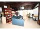The open concept living room features beamed ceilings and lots of natural light at 21921 Us Highway 98, Dade City, FL 33523