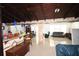 The open living area features stylish tile flooring, beamed ceilings and ample lighting at 21921 Us Highway 98, Dade City, FL 33523