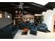 The expansive living room features beam ceilings and comfortable seating at 21921 Us Highway 98, Dade City, FL 33523