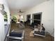 Covered patio with stylish seating and outdoor space for entertainment and relaxation at 21921 Us Highway 98, Dade City, FL 33523