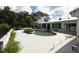 Backyard pool with surrounding patio, lush greenery, and ample space for outdoor enjoyment at 21921 Us Highway 98, Dade City, FL 33523