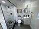 Contemporary bathroom featuring a tiled shower, modern toilet, and vanity at 2509 Thornbrook Pl, Tampa, FL 33618