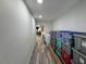 Long hallway with storage and laundry area at 2509 Thornbrook Pl, Tampa, FL 33618