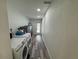 Dedicated laundry area with modern washer and dryer units, plus storage at 2509 Thornbrook Pl, Tampa, FL 33618