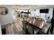 A spacious open-concept living room with a modern kitchen and dining area under recessed lighting at 2509 Thornbrook Pl, Tampa, FL 33618