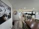 A view of the living area showcases the open floor plan, modern lighting, and adjacent dining space at 2509 Thornbrook Pl, Tampa, FL 33618