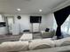 Cozy living area with modern furniture, a flat-screen TV, and a view of the exterior at 2509 Thornbrook Pl, Tampa, FL 33618