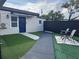 Home with a tidy yard, outdoor seating, and manicured landscaping at 2509 Thornbrook Pl, Tampa, FL 33618