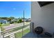 Relaxing balcony area with comfortable seating and a view of the neighborhood at 2568 13Th N Ave # 2568, St Petersburg, FL 33713