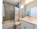 Clean bathroom with shower over tub, modern fixtures, and stylish tile accents at 2568 13Th N Ave # 2568, St Petersburg, FL 33713