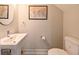 Cozy powder room features a modern sink, toilet, and stylish wall decor at 2568 13Th N Ave # 2568, St Petersburg, FL 33713