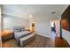Bedroom with wood floors, ceiling fan, walk-in closet, and ensuite bathroom for added convenience at 2568 13Th N Ave # 2568, St Petersburg, FL 33713