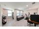 Bright bonus room with ample natural light, stylish seating, and an exercise bike at 2568 13Th N Ave # 2568, St Petersburg, FL 33713