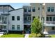 Townhome exterior showcases modern design with multiple balconies and lush landscaping at 2568 13Th N Ave # 2568, St Petersburg, FL 33713