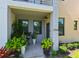 Charming front porch with elegant decor, including potted plants and tasteful furnishings at 2568 13Th N Ave # 2568, St Petersburg, FL 33713