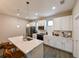 Modern kitchen with white cabinetry, quartz countertops, and stainless steel appliances at 2568 13Th N Ave # 2568, St Petersburg, FL 33713