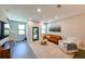 Bright living room with hardwood floors, comfortable seating, and natural light at 2568 13Th N Ave # 2568, St Petersburg, FL 33713