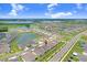 An aerial view displays the property among similar homes in this community, close to a pond and recreation at 31426 Ancient Sage Rd, Wesley Chapel, FL 33545
