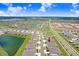 This aerial view shows the property near a large pond, offering scenic views and access to recreation at 31426 Ancient Sage Rd, Wesley Chapel, FL 33545