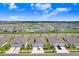 Aerial view of community with new homes, convenient roads and ponds at 31426 Ancient Sage Rd, Wesley Chapel, FL 33545