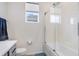 Modern bathroom featuring shower and tub combination and sleek fixtures at 31426 Ancient Sage Rd, Wesley Chapel, FL 33545